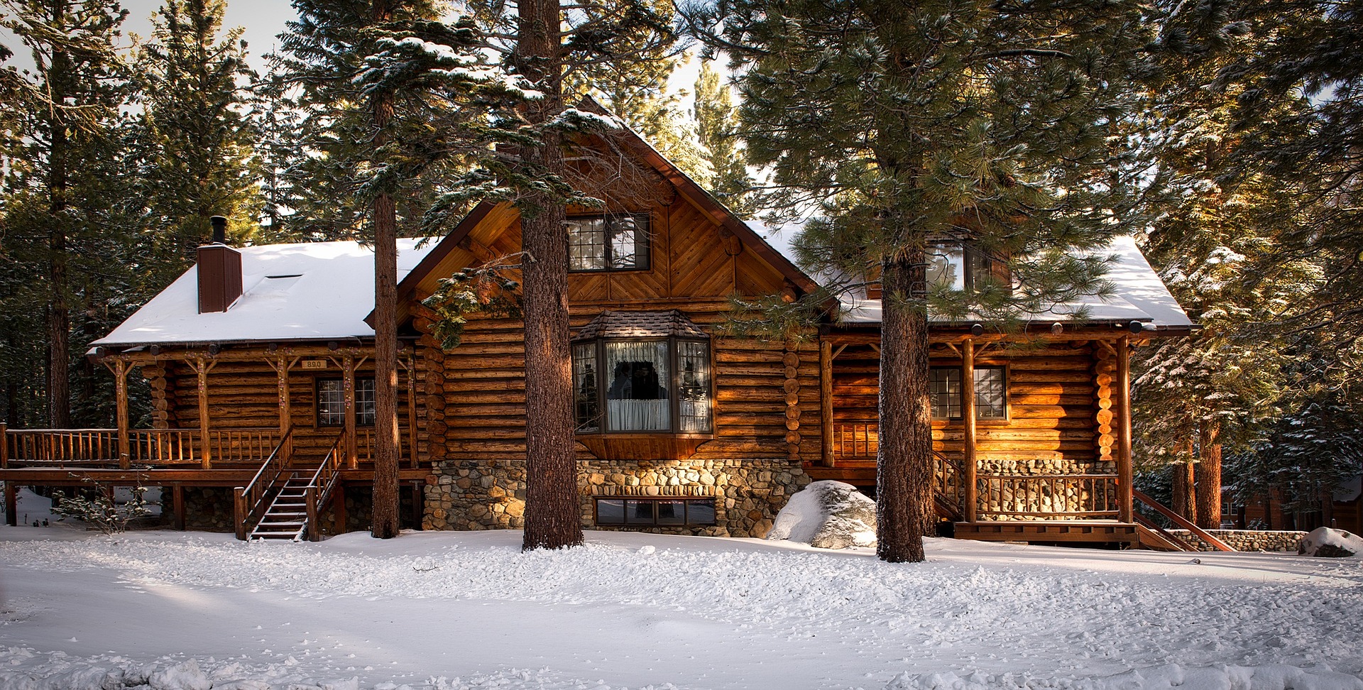 A log cabin covered in snow. Fully insured.  